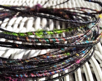 Back Wool fiber wire with bright colored Sari silk.   Fiber coated copper wire.