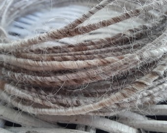 Fiber wire in a variety of natural, undyed fiber types, including merino wool, Teeswater wool, alpaca, angora bunny, and silk