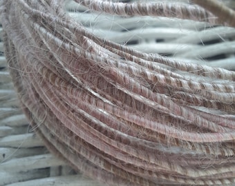 Hand spun fiber wire in 100% natural alpaca in shades of brown, cream and pink.  Fiber covered copper wire.