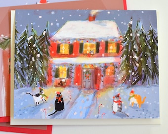 May include: A snowy winter scene with a red house decorated with Christmas lights and candy canes. Four cats wearing hats are in the yard, two are black and white, one is orange and one is gray.