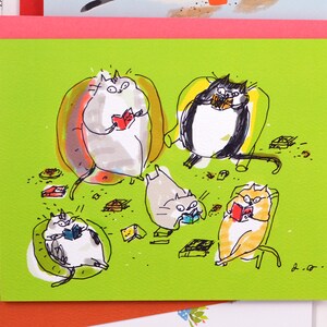 May include: A green card with a drawing of five cats reading books. The cats are sitting in chairs and on the floor. There are scattered books and other objects on the floor. The card has the text "The Dancing Cat" and a website address.