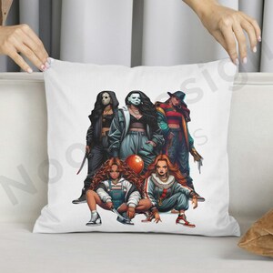 May include: White pillow with a colorful illustration of five women dressed as horror movie characters. The women are holding weapons and a red balloon. The characters are dressed in black, red, and blue clothing.