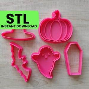 May include: Five pink plastic cookie cutters shaped like a pumpkin, a ghost, a bat, a witch's hat, and a coffin.  The cutters are on a wooden surface.  STL Instant Download.