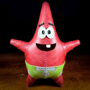 May include: A set of three ceramic nesting bowls in shades of blue, green, and white. The bowls feature a speckled glaze and a simple, modern design. The largest bowl is approximately 6 inches in diameter.