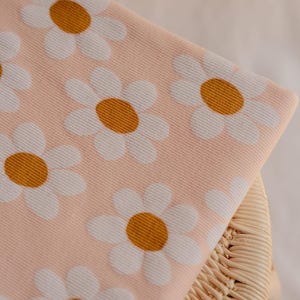 Fun and playful rib jersey fabric with bold floral pattern on a light pink background - premium quality - Tiny Fabric Company