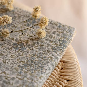 Muslin floral fabric with an adorable pattern of tiny flowers on a soft cream background - high quality