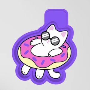 May include: A white cat wearing sunglasses is floating in a pink and yellow donut-shaped pool float. The cat is laying on its back with its paws in the air.