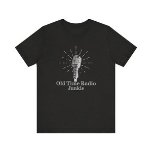 May include: Black t-shirt featuring a vintage microphone graphic and the text "Old Time Radio Junkie".
