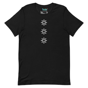 May include: Black t-shirt with three white starburst designs in a vertical row. The shirt has a crew neck and short sleeves. The brand name "Yucaina!" is printed on the upper back of the shirt.