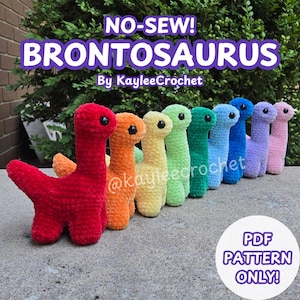 May include: A collection of nine crocheted Brontosaurus plush toys in a row, featuring colors of red, orange, yellow, light green, dark green, light blue, dark blue, purple, and pink. Text reads NO-SEW! BRONTOSAURUS By KayleeCrochet and PDF PATTERN ONLY!