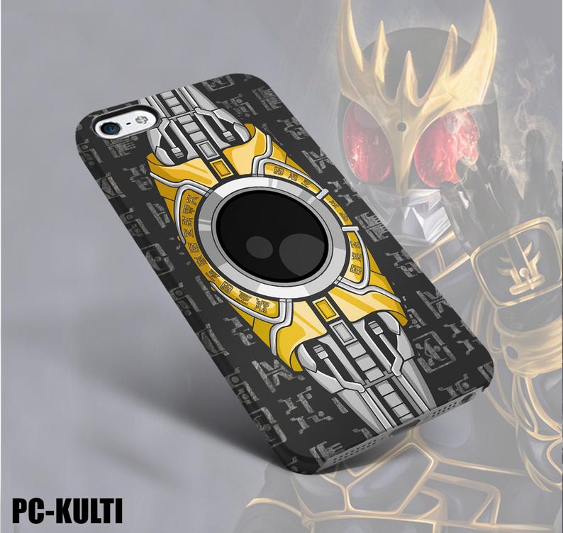 May include: A black phone case with a yellow and silver design. The case features a large black circle in the center, surrounded by a yellow and silver pattern. The case has the text "PC-KULTI" at the bottom.
