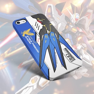 May include: A blue, white, and black phone case featuring a graphic design of a mecha robot. The case has the text "STRIKE FREEDOM GUNDAM" and "MORGENRÖTE ORB" printed on it. The design includes a yellow bird emblem.