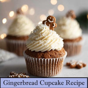 May include: A close-up of a gingerbread cupcake with white frosting, silver sprinkles, and a gingerbread man cookie. Two more cupcakes are blurred in the background. The cupcakes are in white paper liners. The text "Gingerbread Cupcake Recipe" is at the bottom.