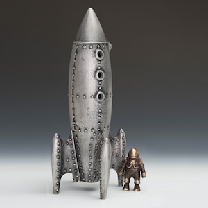 Moon Rocket Coin Bank with One Spaceman - Item #924, Cast Aluminum and Bronze