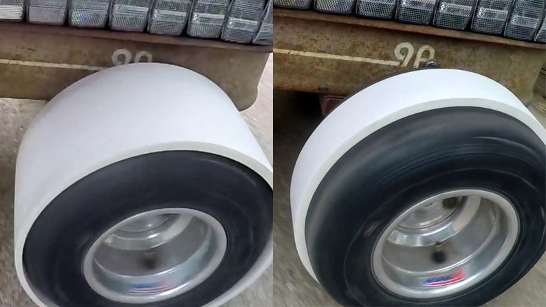 May include: Two white-walled tires with black tread and silver rims. The tires are mounted on a vehicle with a rusty metal frame. The number "90" is visible on the frame.
