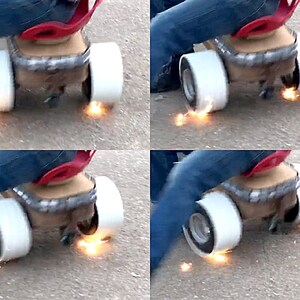 May include: A person riding a toy car with sparks flying from the wheels. The car is made of wood and metal and has a red seat. The person is wearing blue jeans.