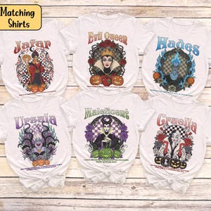 May include: Six white t-shirts showcasing Disney villains: Jafar, Evil Queen, Hades, Ursula, Maleficent, and Cruella. Each shirt displays a distinctive graphic design, the villain's name, and Halloween-themed imagery such as pumpkins and roses.