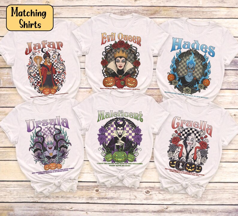 May include: Six white t-shirts showcasing Disney villains: Jafar, Evil Queen, Hades, Ursula, Maleficent, and Cruella. Each shirt displays a distinctive graphic design, the villain's name, and Halloween-themed imagery such as pumpkins and roses.