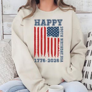Celebrate the red, white, and blue with this stylish Happy 250th Birthday USA kids shirt. Designed with a distressed American flag and vintage-inspired text, this youth patriotic top is perfect for summer parties, Fourth of July celebrations, family cookouts, and patriotic photo sessions. The 1776-2026 design highlights the special 250-year milestone, making it a meaningful keepsake shirt for children during this once-in-a-generation national celebration.