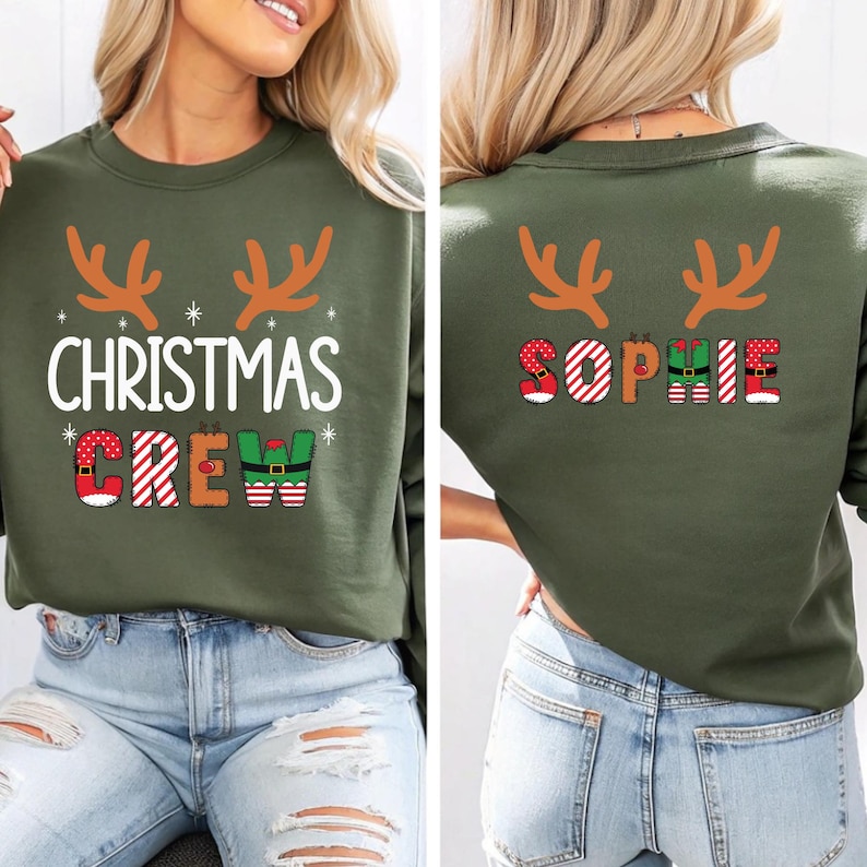 cute christmas crew sweatshirt with reindeer antlers and personalized sleeve name option, matching holiday family sweater for kids and adults, custom christmas shirt for winter celebrations, cozy xmas crew top with festive lettering, personalized holiday gift sweatshirt, christmas pajamas top for family photos, fun reindeer themed christmas sweater, holiday party outfit idea, custom name christmas crew shirt, adorable winter sweatshirt for holiday season