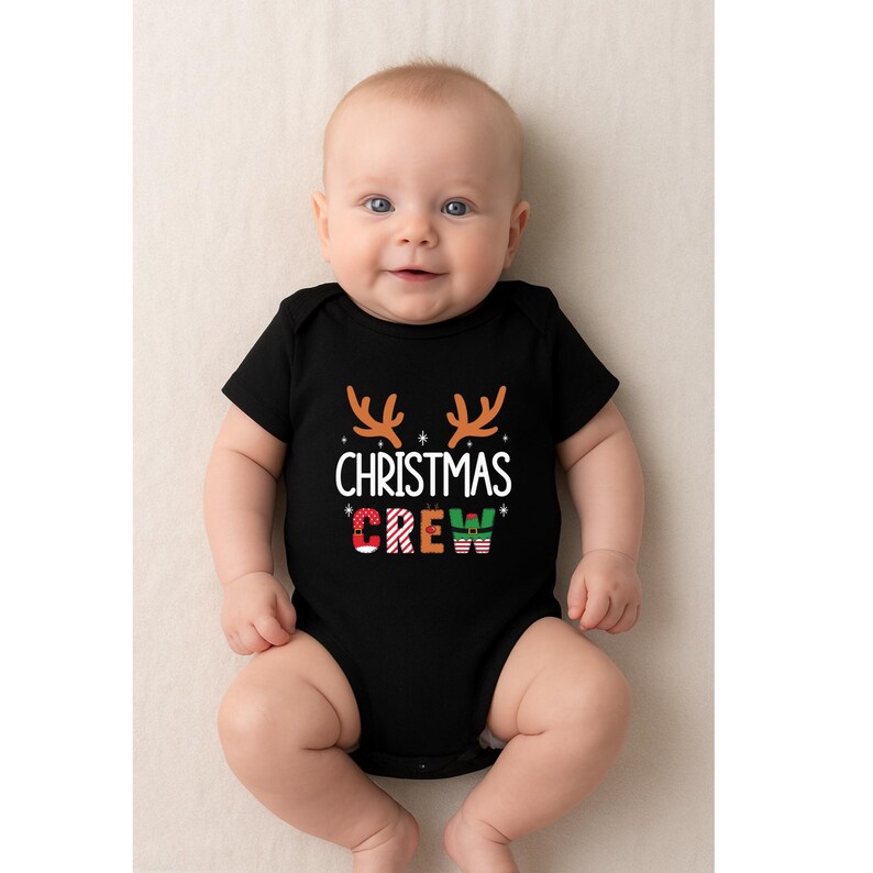 cute christmas crew sweatshirt with reindeer antlers and personalized sleeve name option, matching holiday family sweater for kids and adults, custom christmas shirt for winter celebrations, cozy xmas crew top with festive lettering, personalized holiday gift sweatshirt, christmas pajamas top for family photos, fun reindeer themed christmas sweater, holiday party outfit idea, custom name christmas crew shirt, adorable winter sweatshirt for holiday season