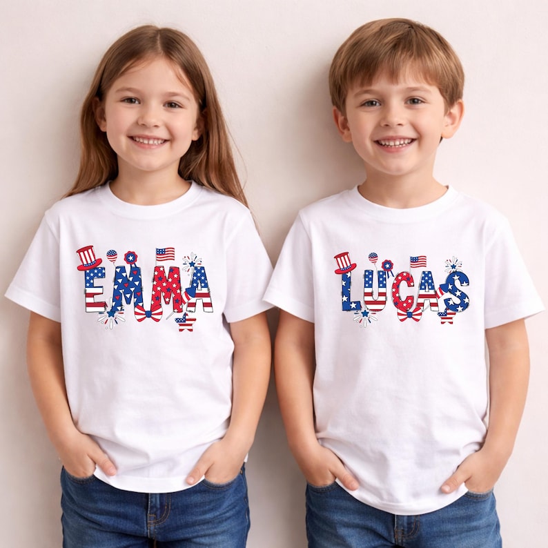 Two smiling young children stand side by side wearing matching personalized patriotic shirts in a soft natural cream color. One shirt features the custom name Lucas and the other shows the custom name Emma in bold red, white, and blue lettering with stars, stripes, fireworks, a patriotic bow, and festive USA-inspired details. This personalized kids Fourth of July shirt mockup highlights a custom name design created for Independence Day and America’s 250th anniversary celebration.