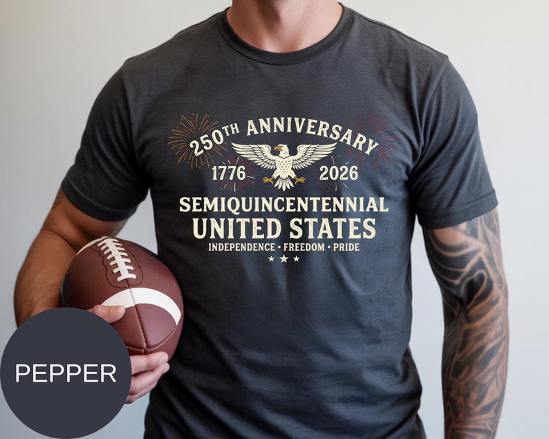 Mark the historic Semi-Quincentennial milestone with this patriotic Comfort Colors® t-shirt. Designed with classic USA typography, fireworks bursts, and a proud eagle centerpiece, it’s ideal for July 4th celebrations and national events. Made from high-quality ring-spun cotton, this Comfort Colors® tee offers superior softness, relaxed fit, and long-lasting print quality for true American spirit lovers.