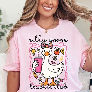 This Silly Goose Teacher Club Shirt is made for educators who bring fun into the classroom. Designed for Teacher Appreciation Week, end of school year gifts, or everyday teacher life. Cute, playful, and relatable, this shirt makes a great gift for women teachers who love geese, humor, and positive classroom vibes.