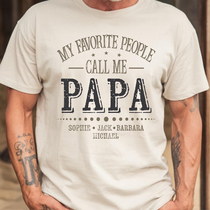 a man wearing a white t - shirt that says my favorite people call me papa