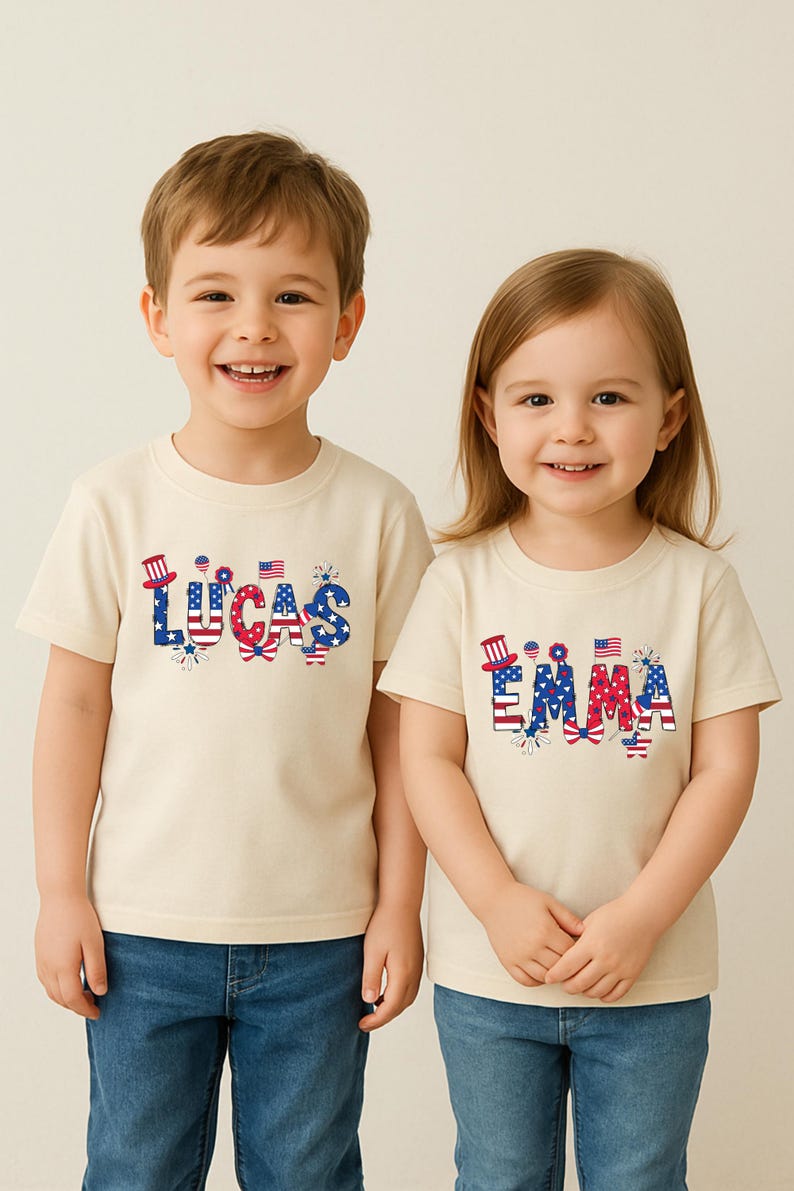 Two smiling children model matching white personalized patriotic T-shirts, one with the custom name Emma and the other with the custom name Lucas. The names are printed in bold red, white, and blue lettering with stars, stripes, fireworks, a patriotic bow, and festive American-themed details. This matching sibling mockup highlights a customizable Fourth of July design created for kids, toddlers, and family celebration outfits honoring America’s 250th birthday.