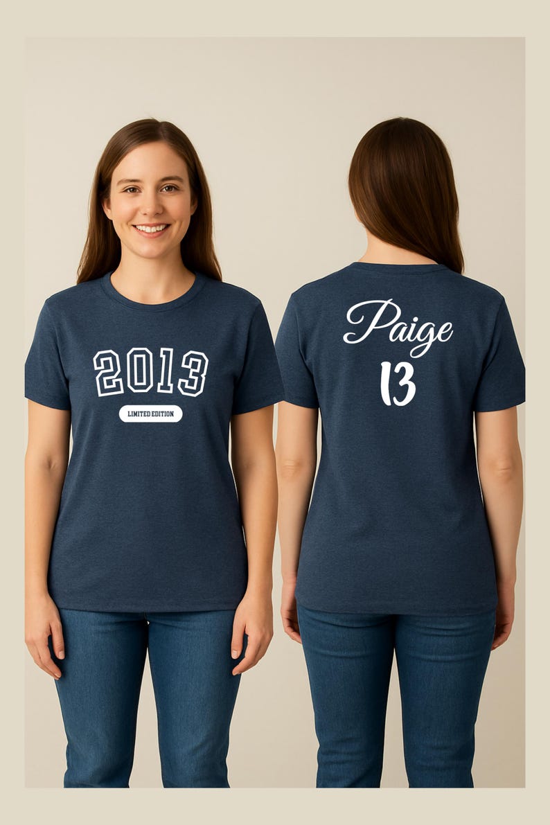 A woman wearing a navy blue t-shirt with the text "2013" and " Paige 13" printed on it, smiling at the camera.
