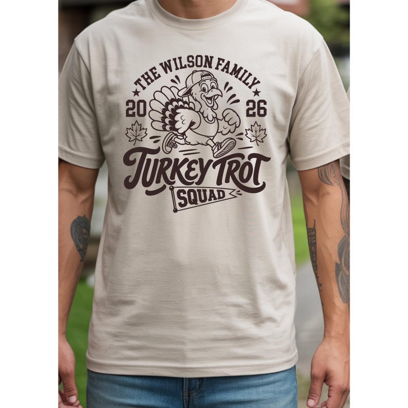 Thanksgiving 2026 matching family shirt set with a vintage Turkey Trot theme. The cream adult and baby shirts feature a running turkey illustration surrounded by autumn leaves and bold retro lettering. The design can be personalized with a family name and is ideal for Thanksgiving morning Turkey Trot races, family reunions, holiday photos, November gatherings, and festive family traditions.