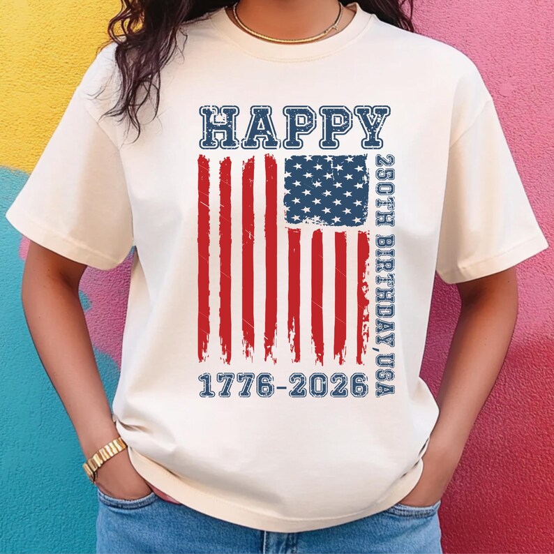 Celebrate America’s 250th birthday in style with this fun patriotic kids shirt featuring a distressed USA flag design and bold “Happy 250th Birthday USA” wording. This youth Fourth of July tee is perfect for parades, fireworks, school events, family parties, and summer gatherings. The vintage-inspired graphic makes it a standout choice for 2026 celebrations while still being a timeless patriotic shirt kids can wear with pride all season long.