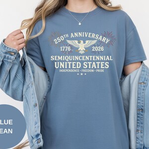 Honor 250 years of independence with this vintage-inspired Comfort Colors® USA shirt. The 1776–2026 anniversary artwork blends heritage fonts, patriotic fireworks, and a detailed eagle graphic. Garment-dyed for rich color and softness, this Comfort Colors® tee feels broken-in from day one. Perfect for parades, BBQs, and patriotic family gatherings.
