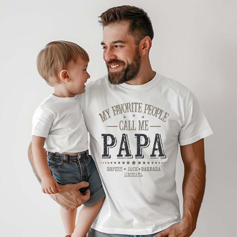 a man holding a small child in his arms
