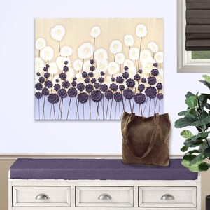 Setting view of color block painting of textured wildflowers on canvas in purple and beige