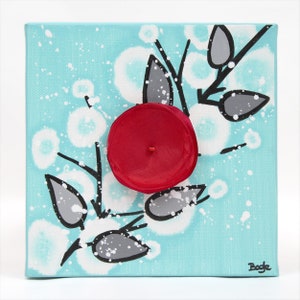 Front view of painting on mini canvas with 3d flower in red, black, and aqua