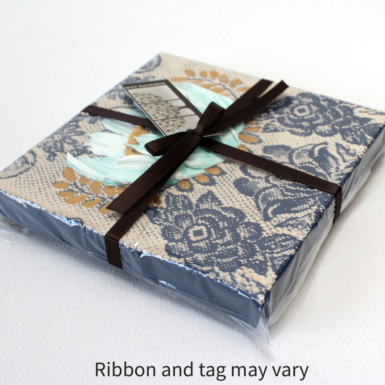 Packaging view of miniature painting in art deco style with a blue impasto flower on a textured background with golden leaves