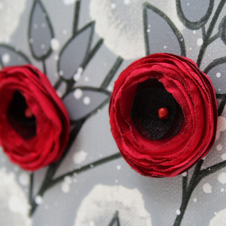 Close up of fluffy hand crafted roses on flower painting on a small canvas in red and gray