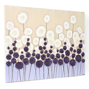 Side view of color block painting of textured wildflowers on canvas in purple and beige