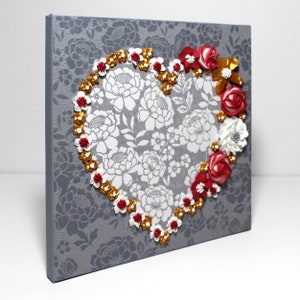 Side view of painting of heart art in red and gold with sculpted rose floral artwork on small canvas