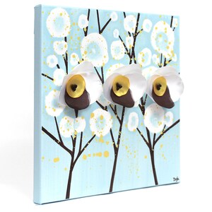 Side view of cheerful painting gift for mom with 3d flowers on a small canvas art in blue, yellow, and white