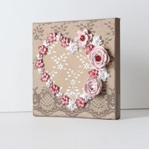 Side view of little valentine heart painting with sculpted roses on a lacy textured canvas for gift for women