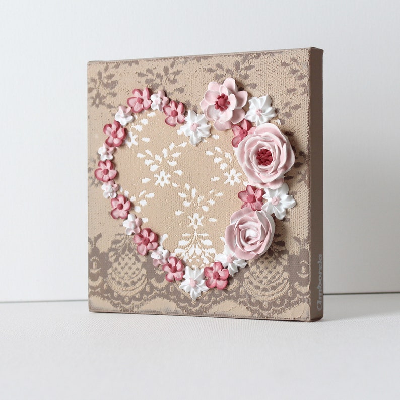 Side view of little valentine heart painting with sculpted roses on a lacy textured canvas for gift for women