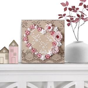 Shelf setting view of little valentine heart painting with sculpted roses on a lacy textured canvas as miniature shelf decor
