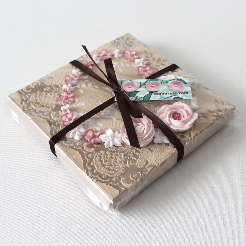 Gift packaging of little valentine heart painting with sculpted roses on a lacy textured canvas as miniature shelf decor