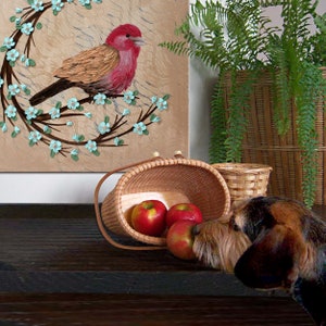 Close up setting view of painting of red finch bird with impasto textured copper feathers on a robins egg blue flowering branch for farmhouse wall art