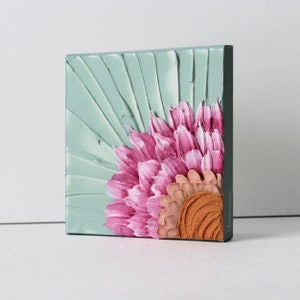 Side view of berry and peach sunflower art with impasto texture painted on a mini square canvas