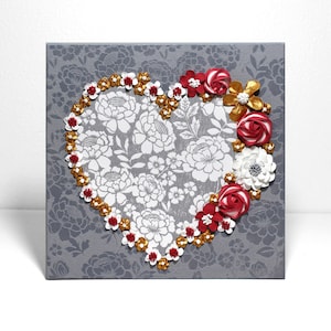Front view of painting of heart art in red and gold with sculpted rose floral artwork on small canvas