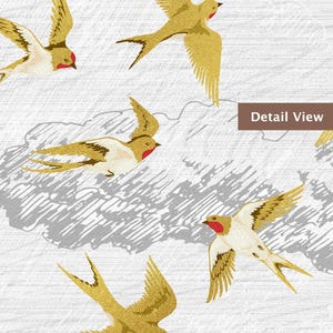 May include: Illustration of several gold-colored birds with red accents, wings spread in flight. The birds are set against a white background with gray, cloud-like shapes. The words "Detail View" are in a brown rectangle.